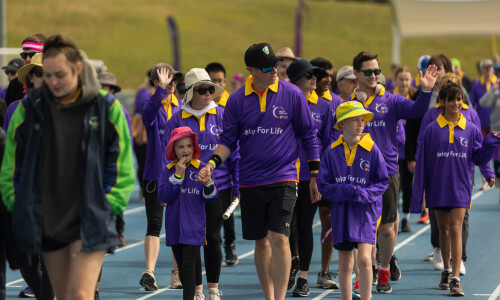 Children and adults participate in Relay for Life